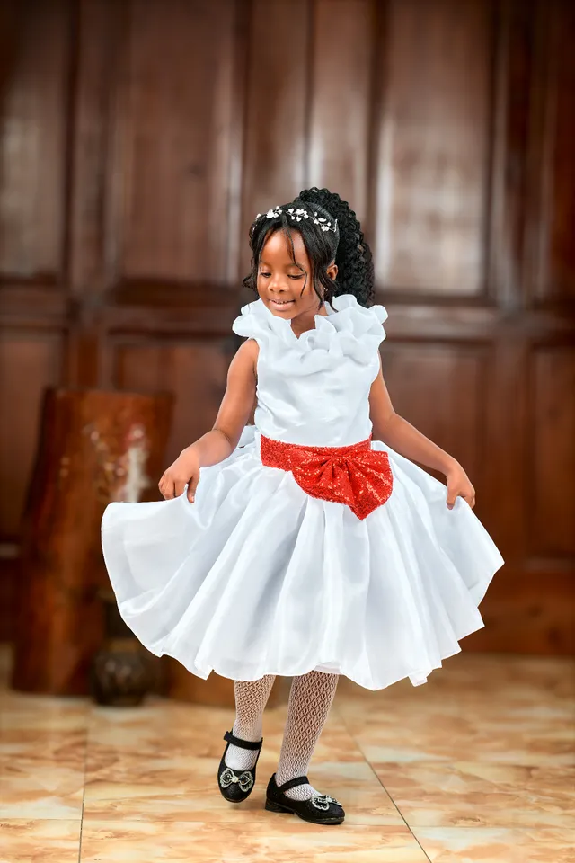 white with red bow dress